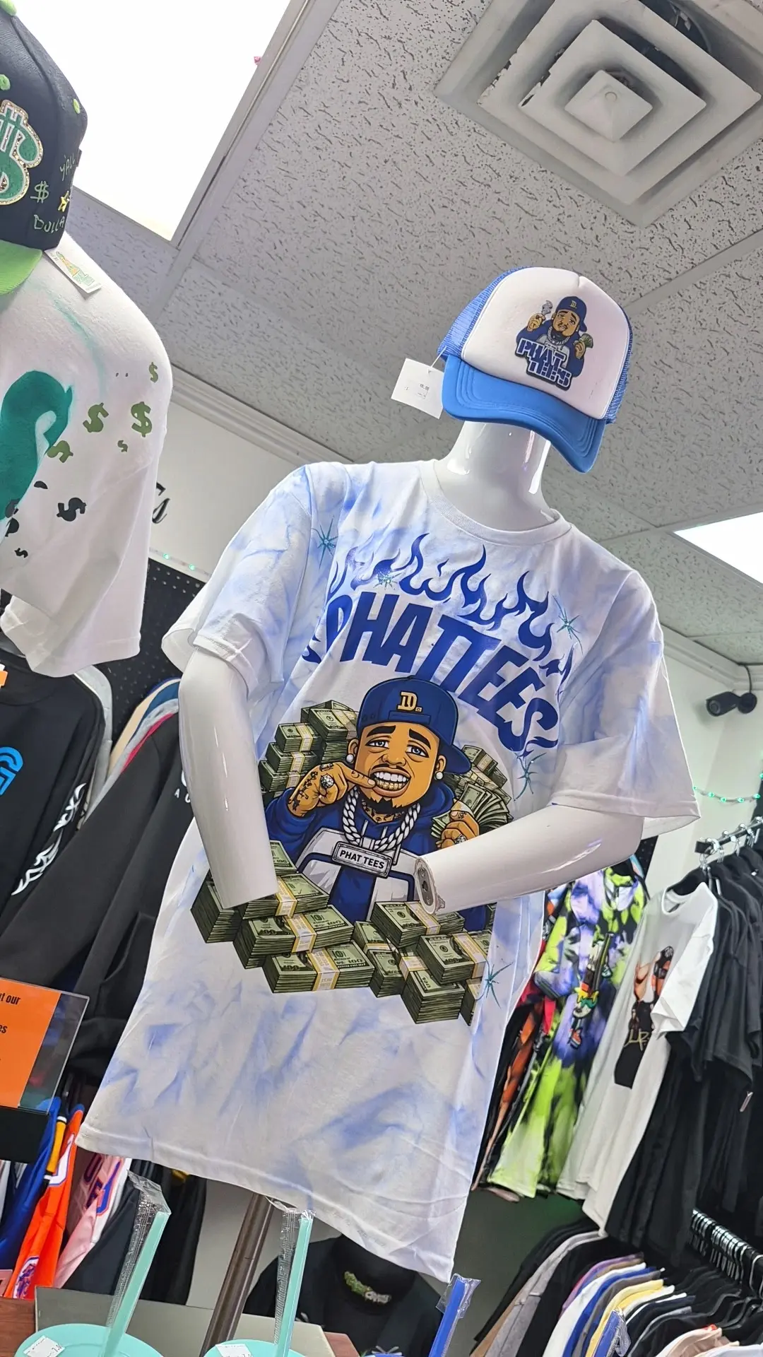 Mannequin wearing a blue and white Phat Tees shirt and matching hat